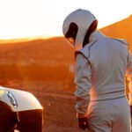 A,Helmet,Wearing,Race,Car,Driver,In,The,Early,Morning